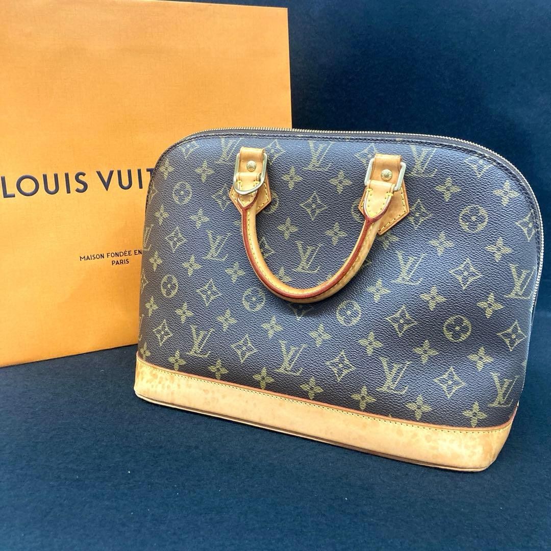 LOUIS VUITTON Alma Monogram Handbag